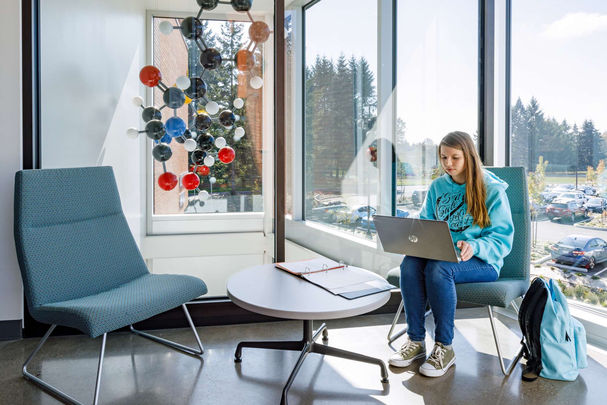 A student on her laptop in a DeJardin Hall study alcove