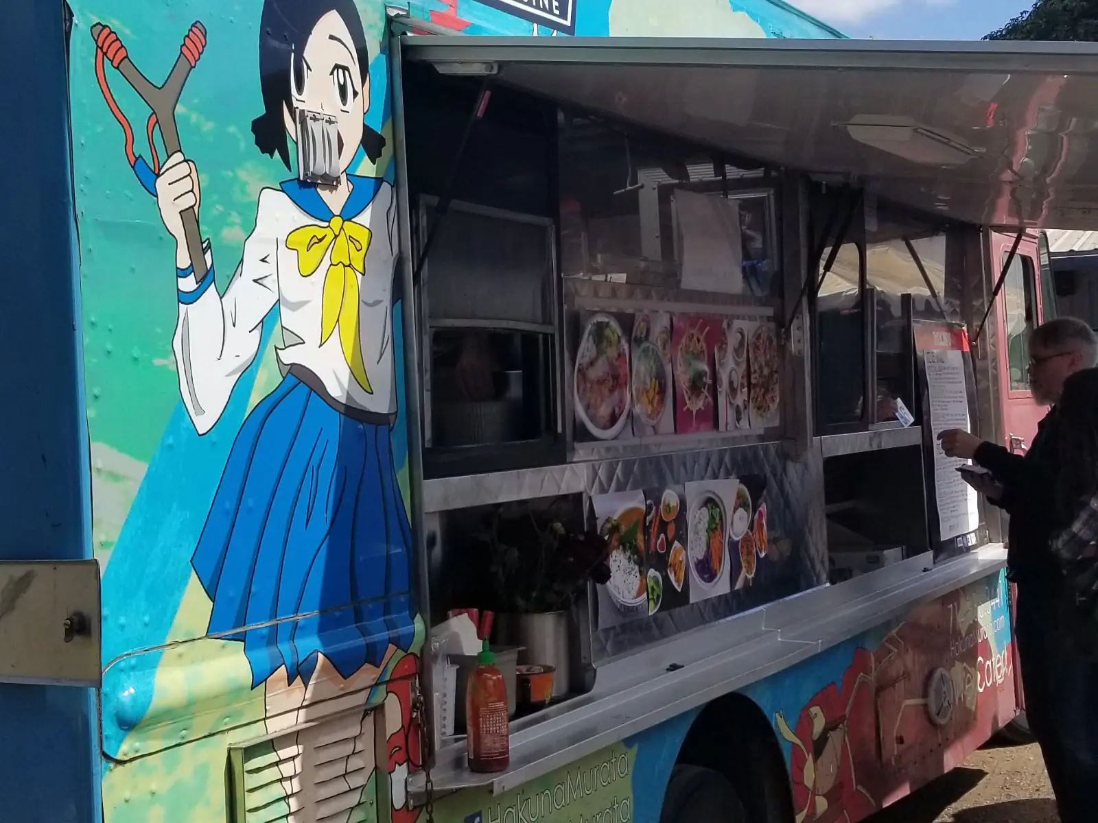 "Hakuna Murata", a Japanese and Filipino Cuisine food truck, featuring an anime character painted on its side, parked at the Wilsonville campus