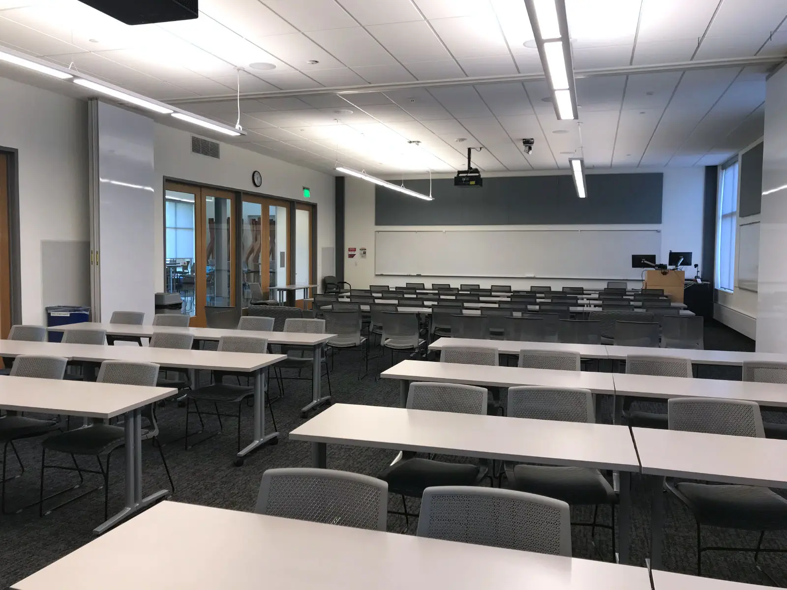A classroom with many rows of tables and chairs in the Industrial Technology Center