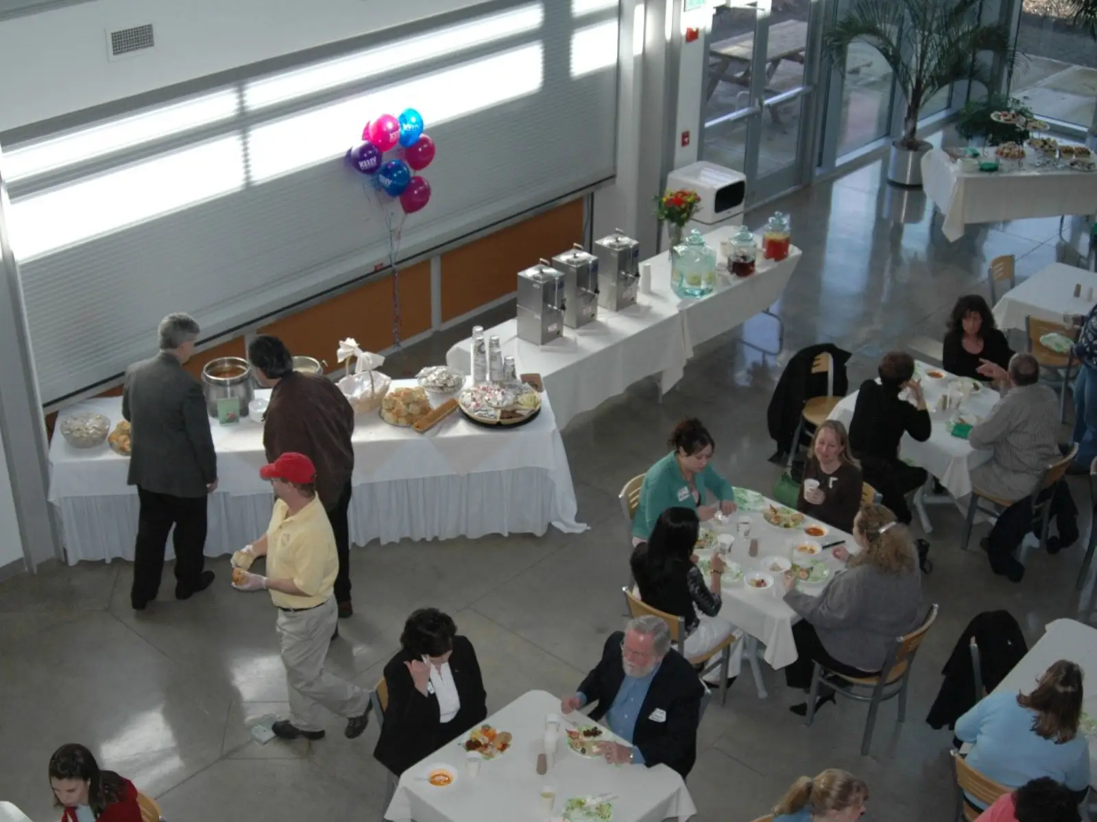 Overhead view of a catered event with various foods and drinks at the Wilsonville campus in the commons