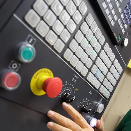 Close up of a CNC machine's control panel.